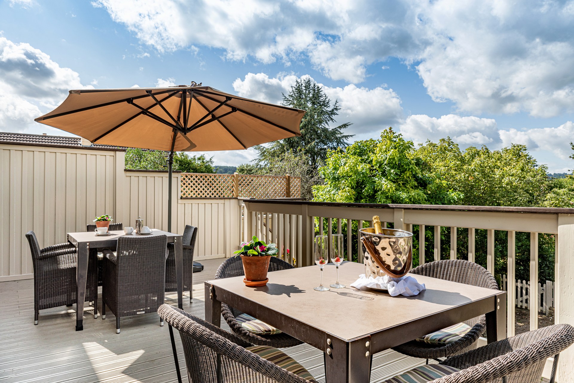 Tables, chairs and a parasol on the Lorne House verandah